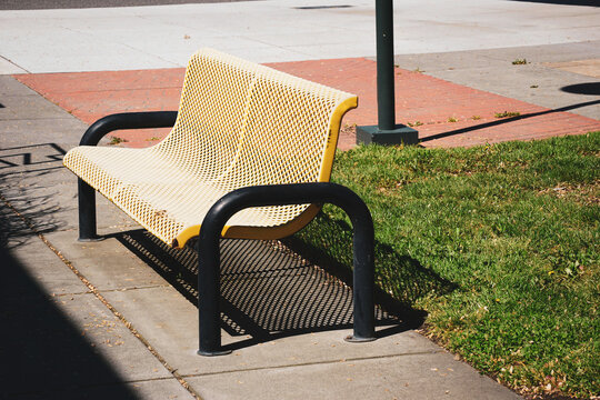 Old metal bench in outdoor courtyard