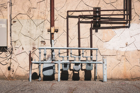 Utility meters in rundown urban alley
