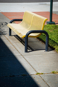 Old metal bench in outdoor courtyard