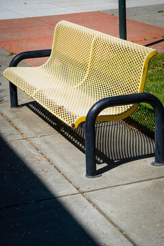 Old metal bench in outdoor courtyard