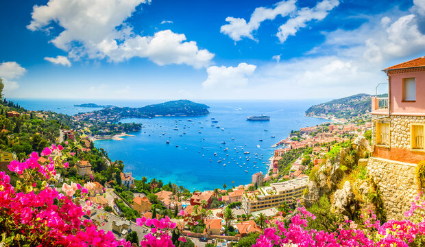 panorama of colorful coast and turquiose water of cote dAzur, France, web banner with flowers