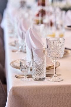 Elegant banquet table setting with crystal glass and folded napkin