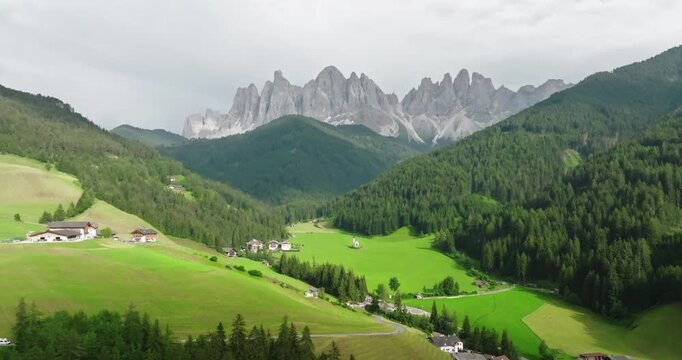 Aerial of the Odle mountains and Santa Magdalena village, Funes Valley, Dolomites, Italy