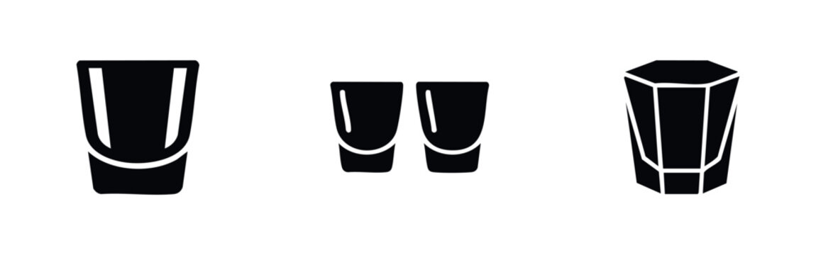 Minimalist black silhouette icons of various shot glasses, featuring standard, double, and faceted designs for bar, cocktail, and drink themes.