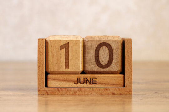 June 10 wooden calendar on desk concept of routine deadline pressure and repetitive daily workflow