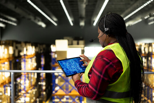 Black woman, artificial intelligence, customer service calls, ensure express delivery, cargo shipment with tracking info on software. AI-powered process for AWB and barcode numbers.