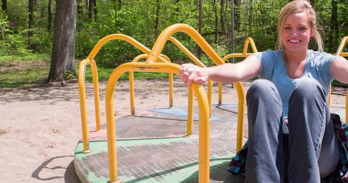 Girl on merry go round rotates by 4k

