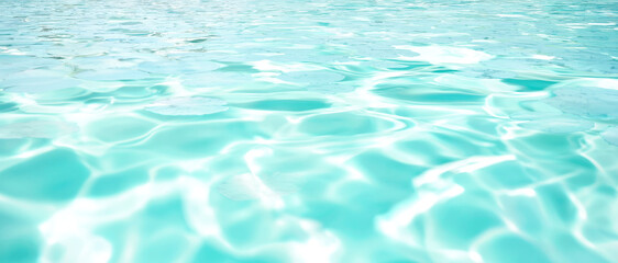 Obraz premium Abstract turquoise water surface with rippling light patterns and lily pads