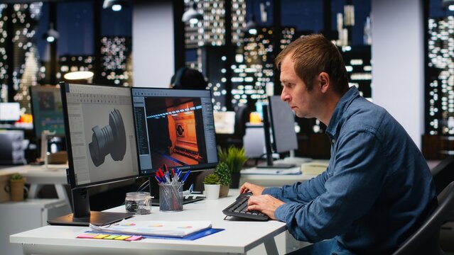 Male IT engineer uses AI techniques to create video game and a turbine, futuristic gaming design for a Mars station project. Sci fi system for a modern game lobby, professional software. Camera B.