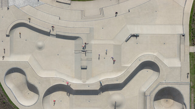 Aerial view of Zeeburgereiland Skate Park featuring concrete bowls, ramps, and skaters in Amsterdam, Noord-Holland, Netherlands.