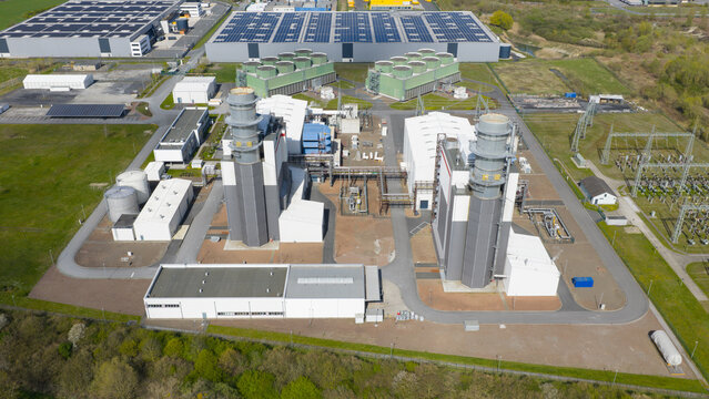 Aerial view of the Trianel Gaskraftwerk Hamm power plant with its tall chimneys and industrial infrastructure in Hamm, Nordrhein-Westfalen, Germany.