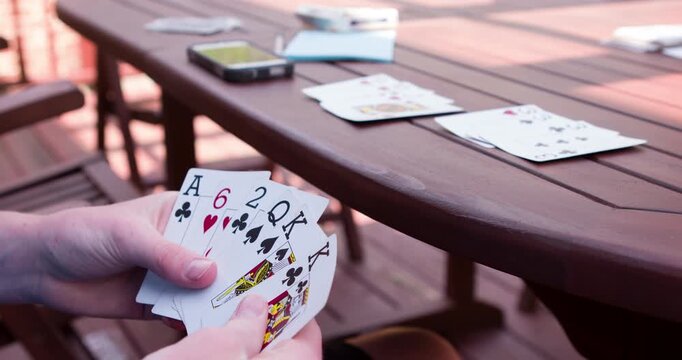 Playing Bid Euchre card game 4k
