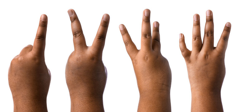 Little child counting using fingers against white background, closeup. Set of hand gestures