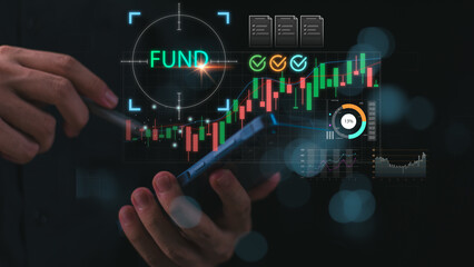 Fototapeta premium Financial investors monitor fund performance and financial market trends through digital analytics, portfolio tracking, investment research, growth forecasting, and strategic asset management.