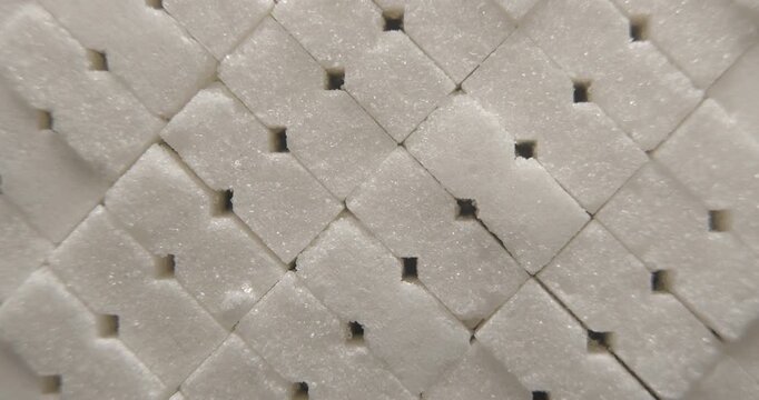 Sugar cubes close up studio shot over rotating