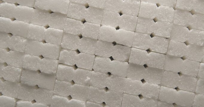 Sugar cubes close up studio shot over rotating