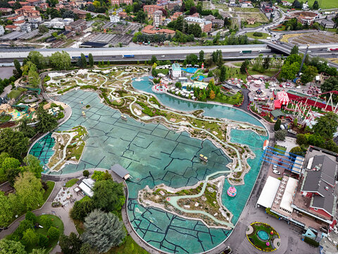 Aerial view theme park featuring the Minitalia miniature map of Italy surrounded by water and lush greenery.