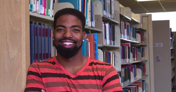  Smiling young man in Library 4k