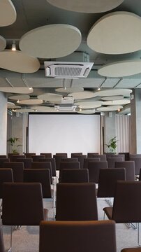 Empty modern conference room with projector screen