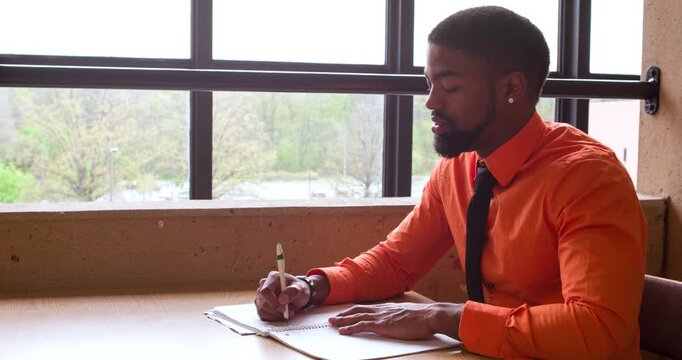 Professional student writing in note pad pan 4k
