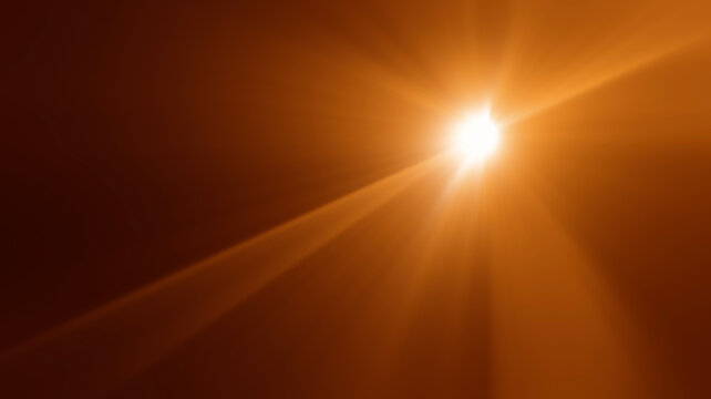 abstract image of light burst among trees and glitter bokeh. image is blurred. yellow golden bokeh pattern background. Real optical lens flare on black backdrop. sunrays, sun rays beam, burst, sunbeam