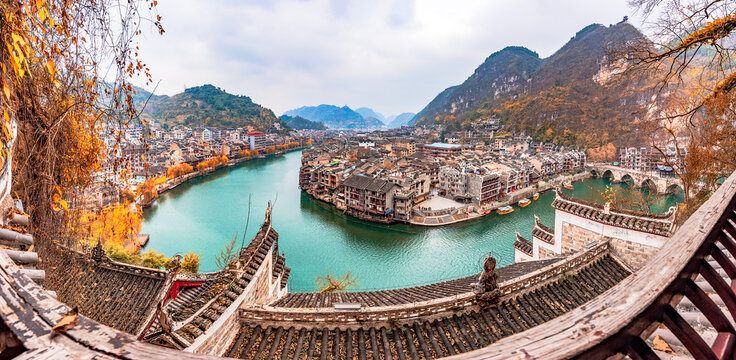 A bird's-eye view of Qinglong Cave in Zhenyuan Ancient Town, Guizhou, China, at dawn from Shiping Mountain.