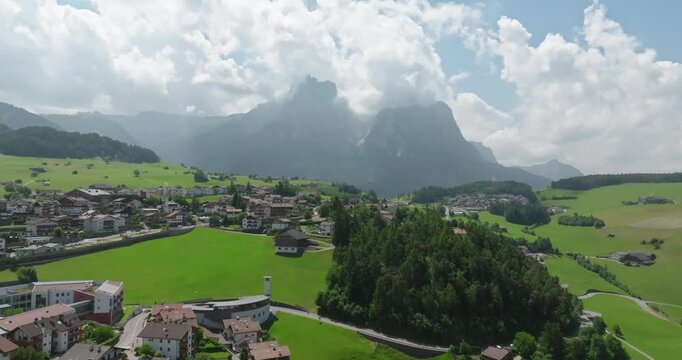 Aerial of Schlern mountain from Castelrotto, Dolomites, Italy