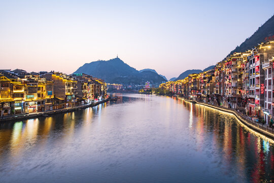 A bird's-eye view of Qinglong Cave in Zhenyuan Ancient Town, Guizhou, China, at dawn from Shiping Mountain.