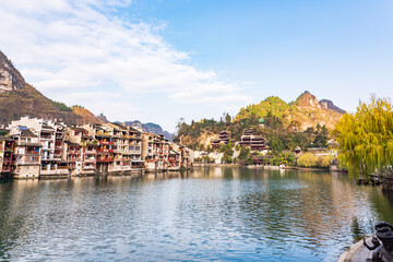 Fototapeta premium Panoramic Winter Sunset Scenery of Zhenyuan Ancient Town in Qiandongnan, Guizhou, China