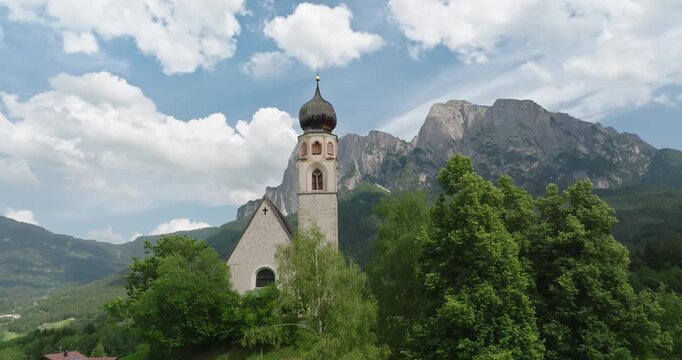 Aerial view of Saint Constantine Church and Schlern Mountain, Dolomites, Italy