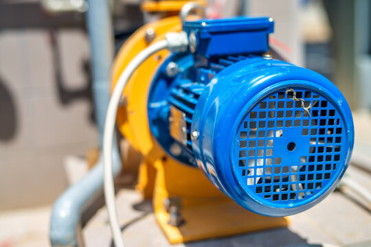 Industrial equipment inside wastewater treatment facility with pipes and filtration machines