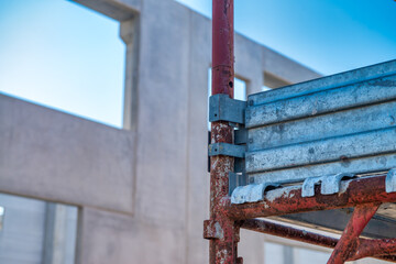 Active construction site exterior showing cranes, scaffolding, and high-rise building progress © jovannig