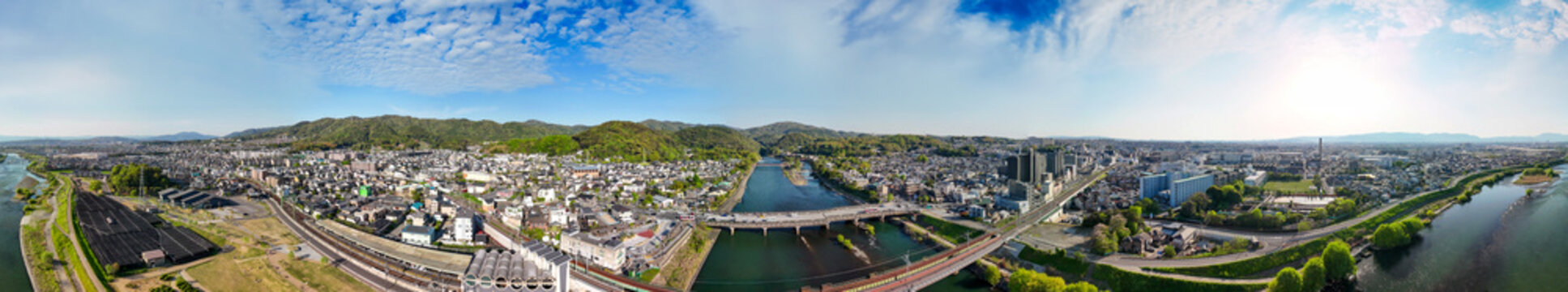 Uji Japan aerial view on sunny day with river, temples and urban landscape
