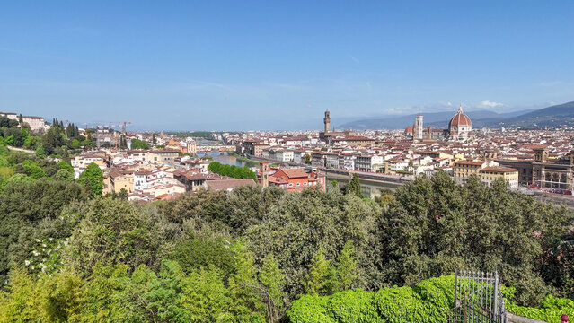 Aerial drone view Florence Italy featuring Duomo Arno River Ponte Vecchio red rooftops Tuscan hills cityscape panorama