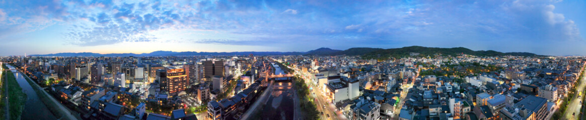 Obraz premium Kyoto aerial night view with Kamo River and illuminated city buildings skyline