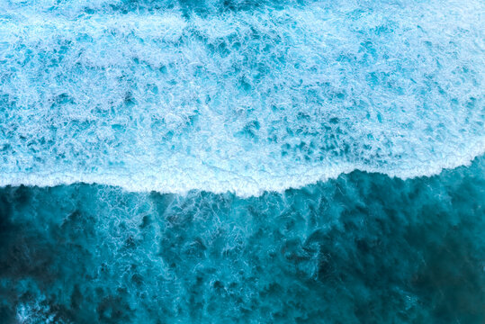 Banner Blue ocean Turquoise sea water white foam wave pattern splashing deep blue sea. Banner Tropical sea beach Seascape dark background splash on rock. Summer Ocean Surface wave with copy space