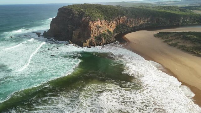 Princetown Beach, Victoria, Australia: 4K aerial drone footage of Gellibrand River mouth, sandy beach, ocean waves, forest, cliffs and coastal landscape. 