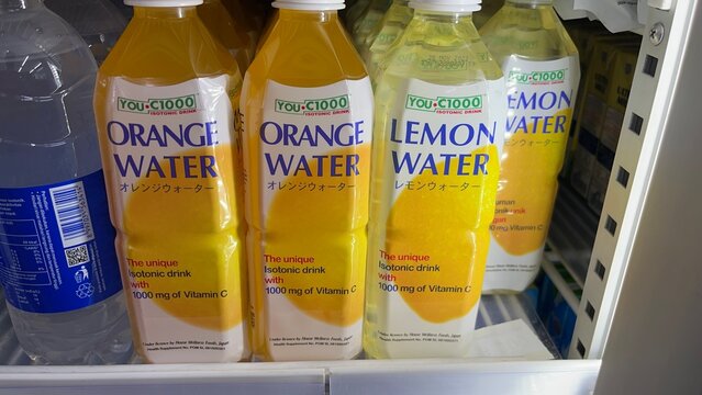 YOU-C1000 Orange Water and Lemon Water brand isotonic drinks with 1000mg of Vitamin C on display inside a supermarket retail refrigerator - Bali, Indonesia, March 24, 2023