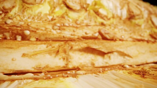 Dolly Slider Extreme Close Up Of Jackfruit Surface And Interior Layer, Camera Gliding Along Spiky Texture, Tropical Organic Food Detail, Studio Lighting, Visible Fibers And Seeds