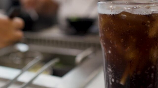 Cold Cola Drink with Ice at an Asian Barbecue Restaurant