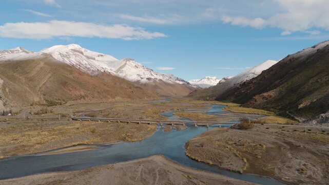 Sweeping Aerial View of R&iacute;o Grande and Surrounding Snow-Capped Mountains route 40 in Mendoza, Argentina