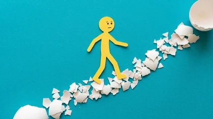 Walking on eggshells: a fragile path representing the anxiety of navigating sensitive situations or volatile tempers where one wrong step leads to a breakdown of peace and safety. © Everlasting Dreams