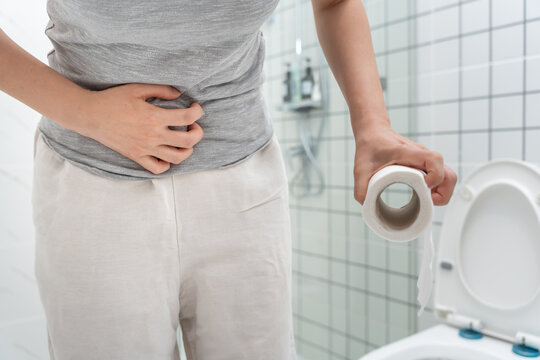 Constipation and diarrhea in bathroom. Hurt woman touch belly  stomach ache painful. colon inflammation problem, toxic food, abdominal pain, abdomen, constipated in toilet, stomachache, Hygiene