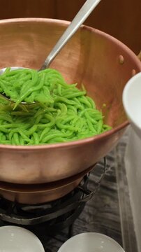 Serving Traditional Thai Lod Chong Pandan Noodles from a Copper Pot
