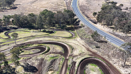 Obraz premium Aerial View of Winding Motocross Track and Rural Road in Queensland