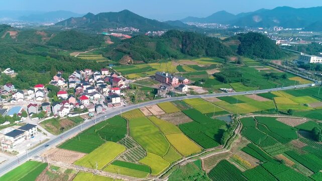 Aerial View of Rural Village and Patchwork Farmland in Green Mountains