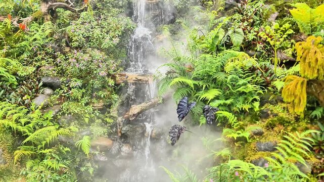 Serene Misty Waterfall in Lush Green Tropical Zen Garden
