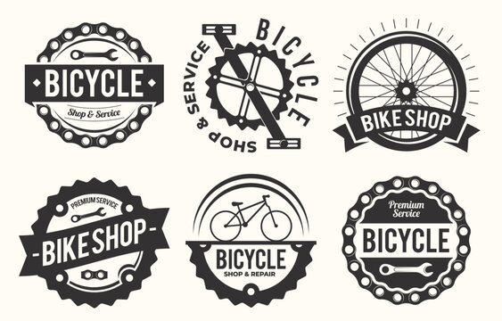 Creative vintage style bicycle shop and repair logo designs featuring wheels wrenches and chain elements