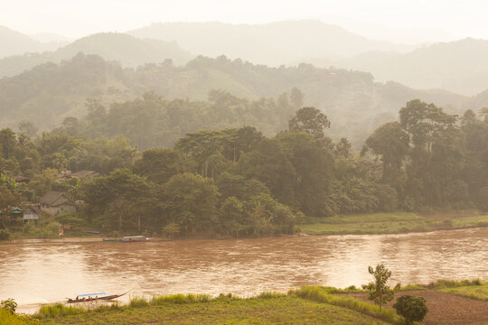 The Kok River flows through the mountains and tribal villages of Chiang Rai.