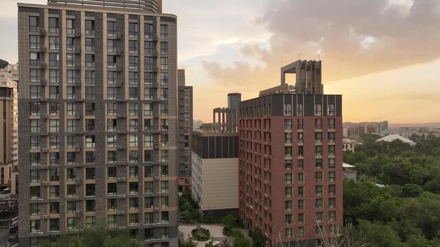 A drone view of the central part of Almaty, Kazakhstan, during sunset on a spring evening.